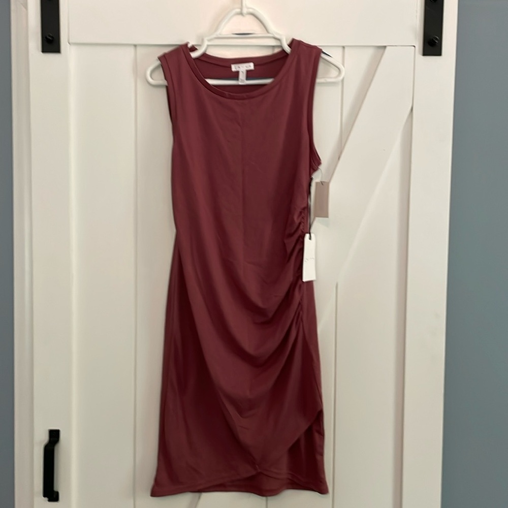 Leith side ruffled knee length dress with tulip like hem in front